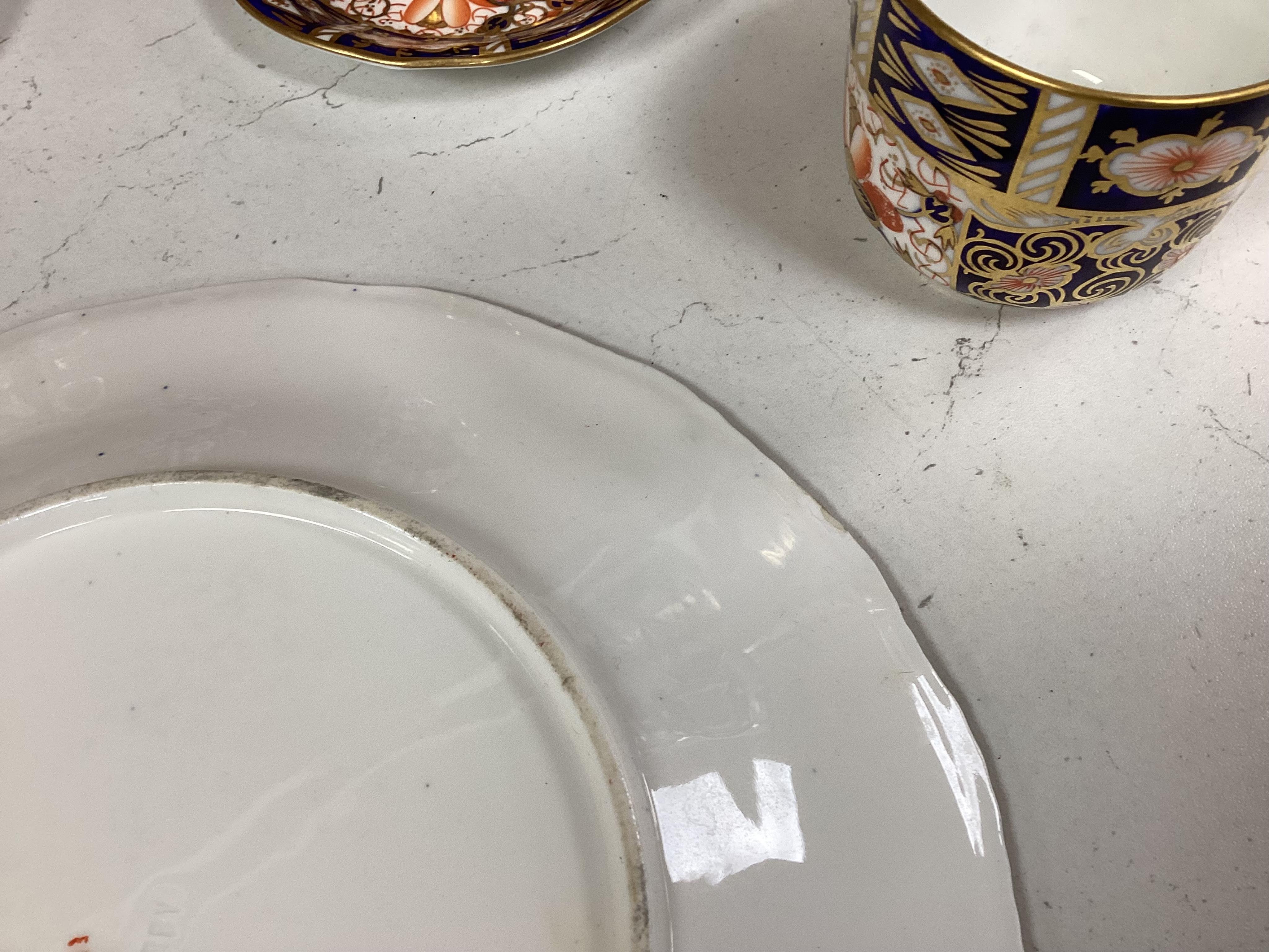 A Crown Derby Imari seven trio place setting, three other cups and two saucers, a large plate and a pair of Doccia- style vases, 18cm high